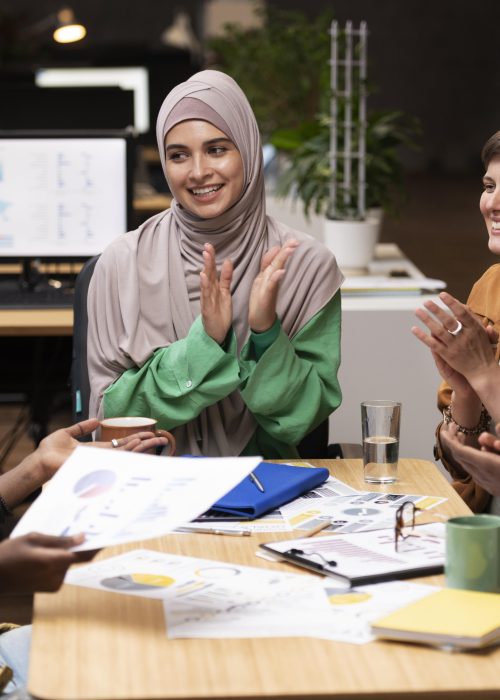 close-up-happy-colleagues-applauding